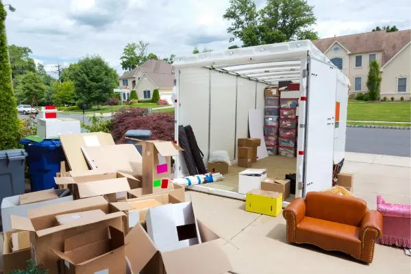 storage container in driveway being loaded with personal effects