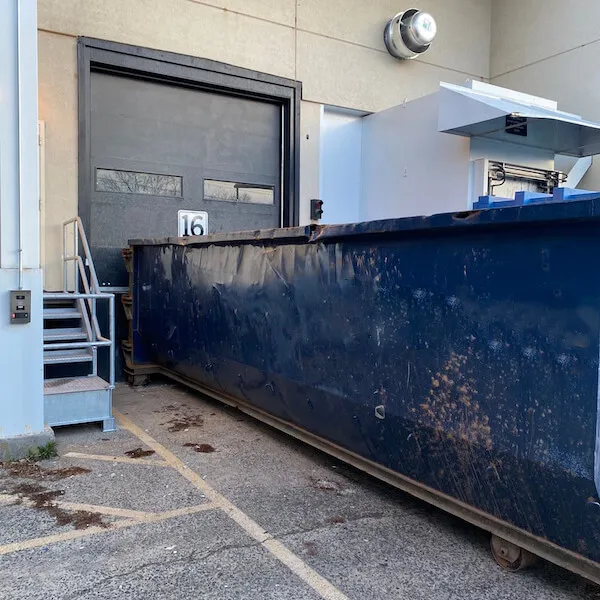 A roll-off dumpster rental at a loading dock in Aliquippa PA