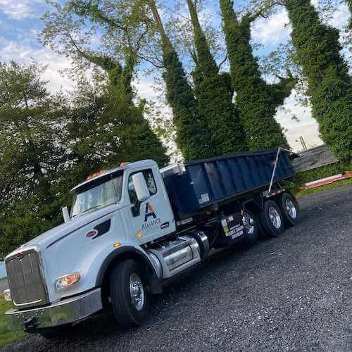 Sourgum Waste formerly Alliance Disposal roll-off truck with a dumpster in Allegheny County PA