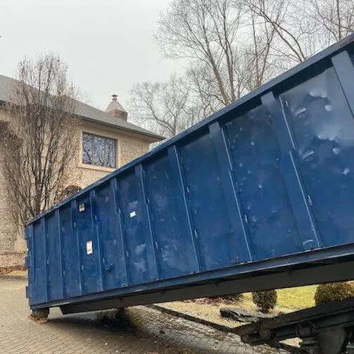 Image of dumpster in paved driveway