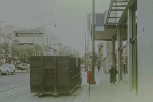 dumpster outside a business downtown