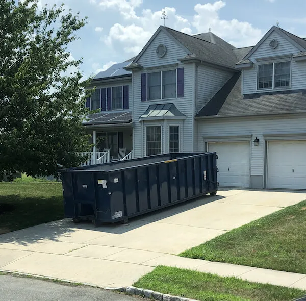 30 yard dumpster rental in a driveway in the state of Delaware