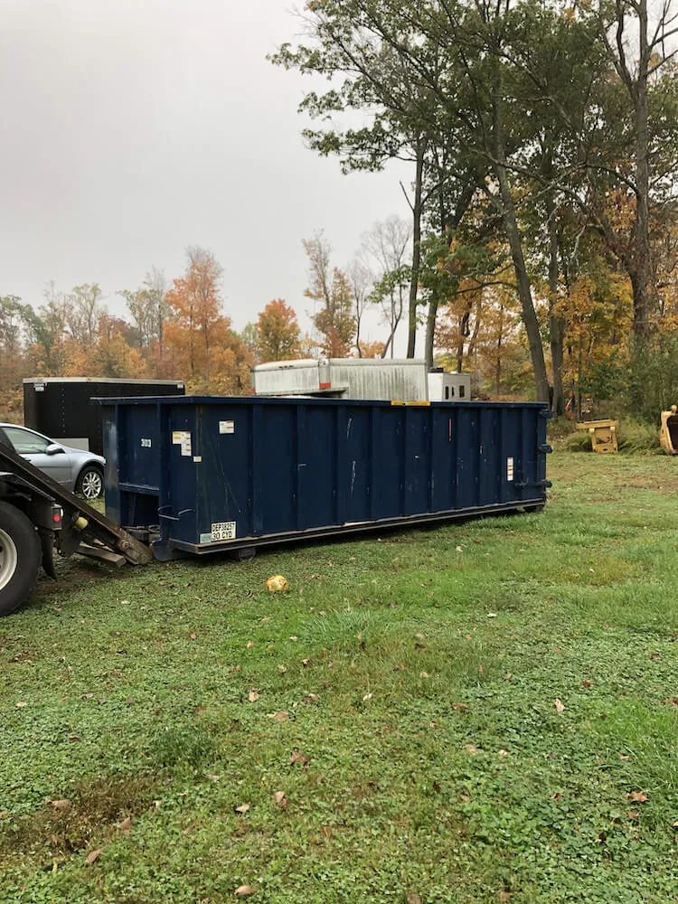 Picture of a dumpster being rolled off in Atlantic County NJ