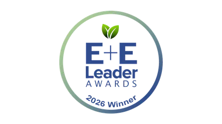 Circular logo for E+E Leader Awards, 2026 Winner, featuring green leaves above the text, with a blue and green gradient border.