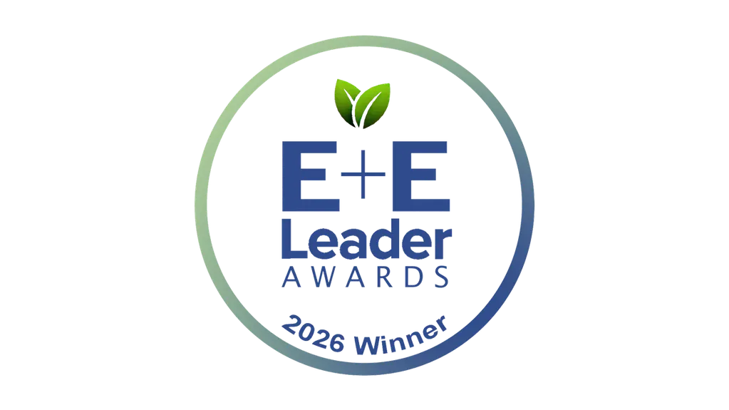 Circular logo for E+E Leader Awards, 2026 Winner, featuring green leaves above the text, with a blue and green gradient border.