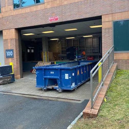 Image of dumpster inside of a warehouse