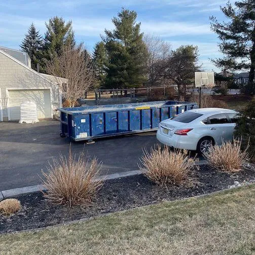 Picture of large dumpster on property 