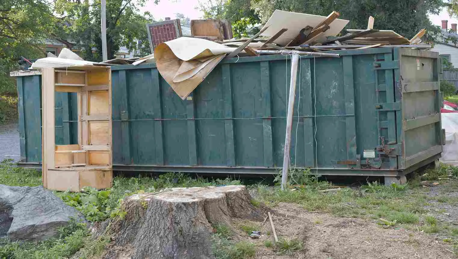 dumpster filled incorrectly with wood 