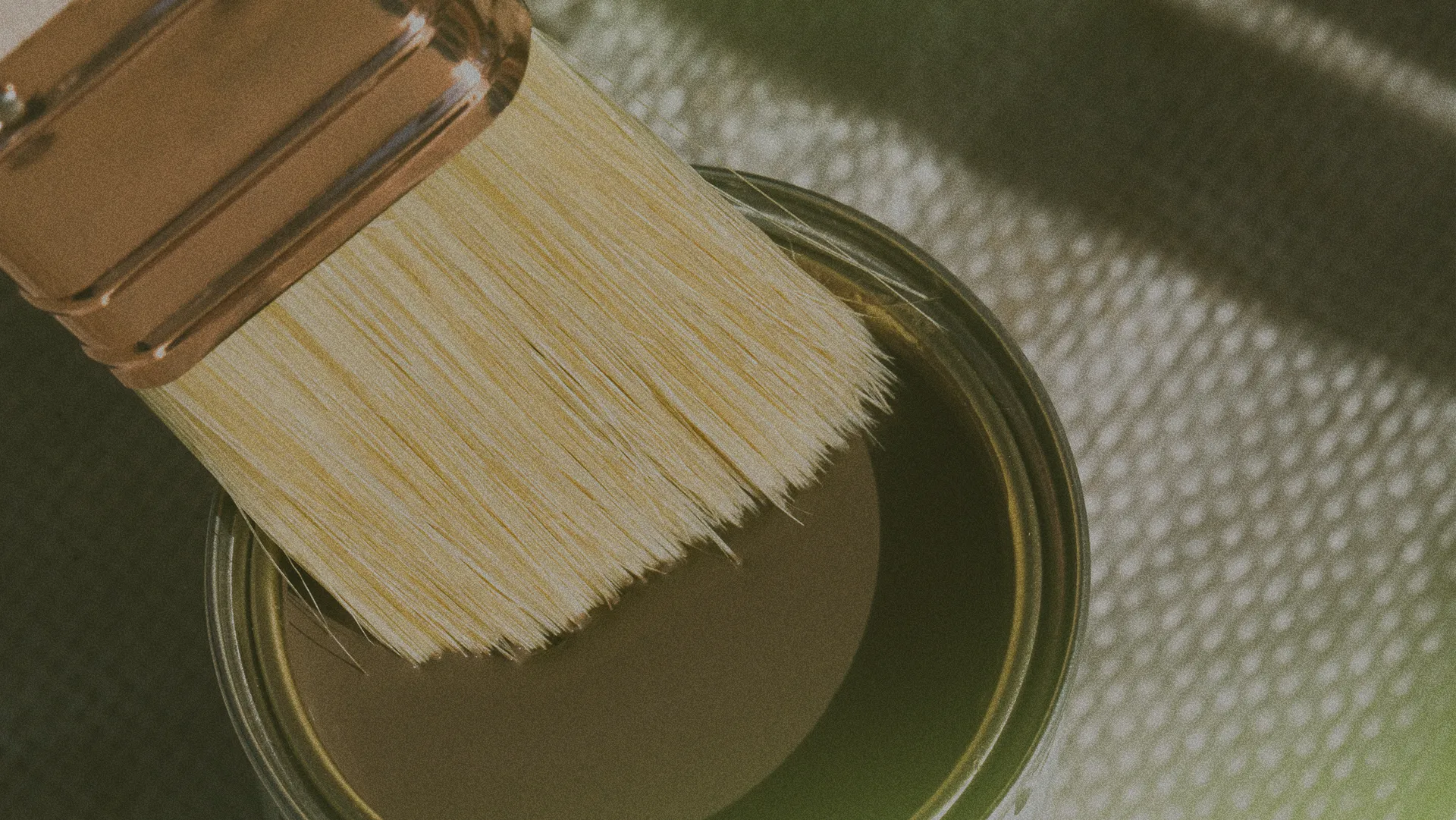 open paint can and paint brush