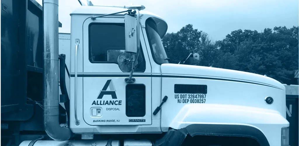 Image of roll off dumpster truck up close