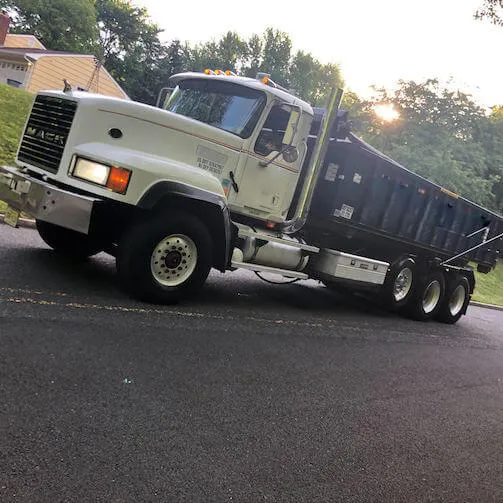 Image of roll off truck on empty street