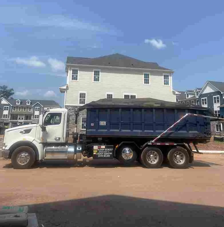 dumpster truck filled with wood in Greensboro