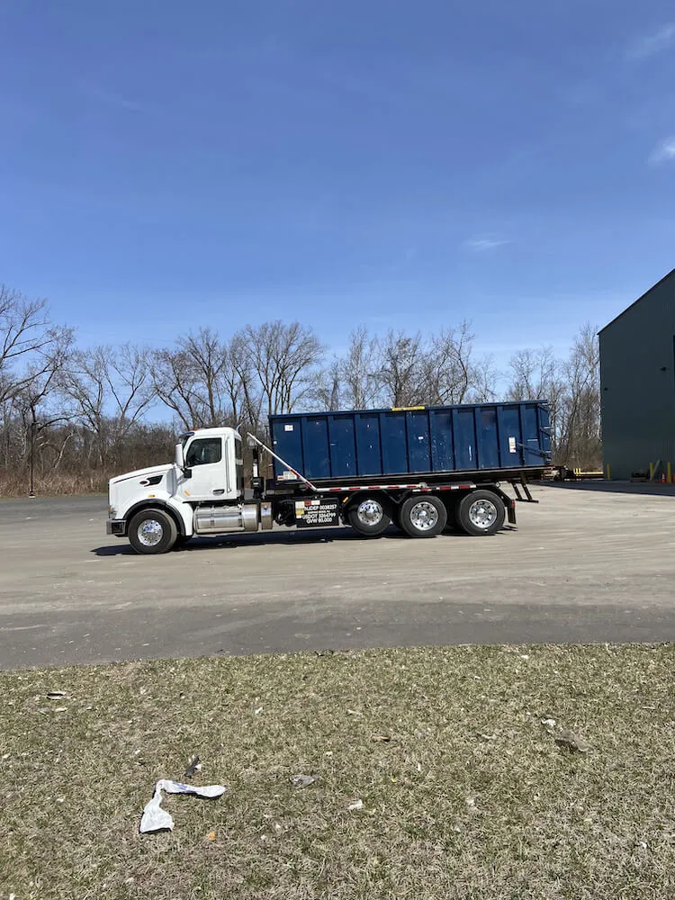 Image of truck on tarmac with grass