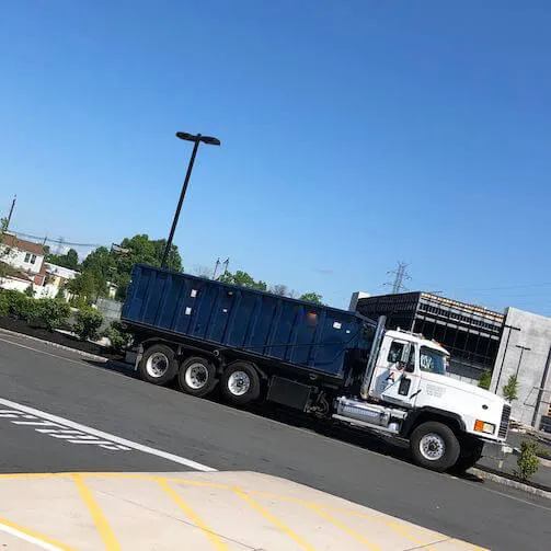 Roll off dumpster truck in residential area