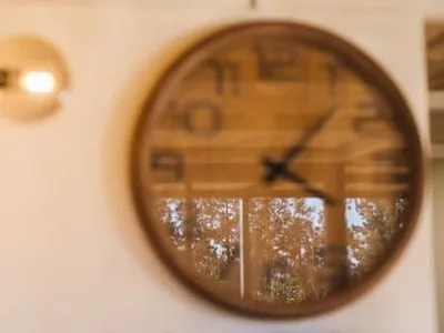 a wooden clock on the wall